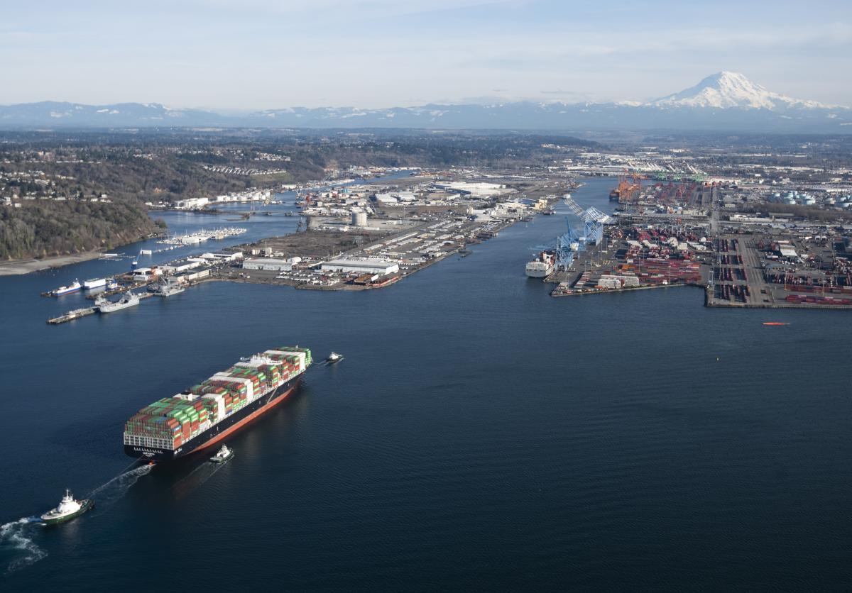 An aerial shot of a ship coming into Port.